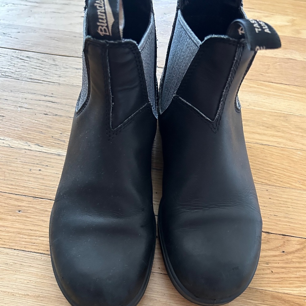 Black and grey blundstone boots